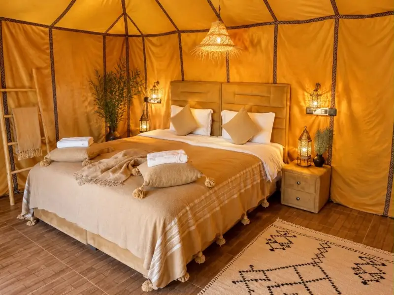 Cosy Berber-style tent with a double bed in the desert camp