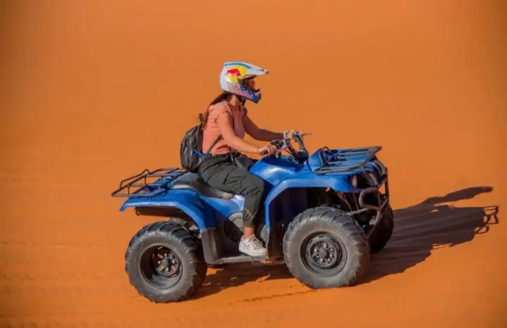 Rider on a blue quad bike in the Erg Chebbi dunes