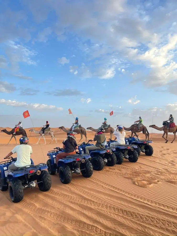 Quad bikes and a camel caravan in the Erg Chebbi desert
