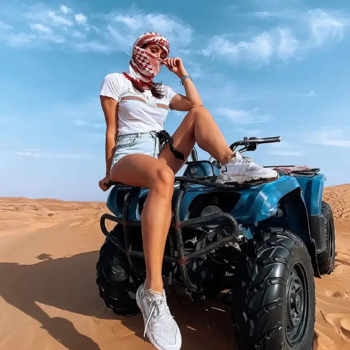 Smiling rider on a quad bike in the Sahara near Merzouga