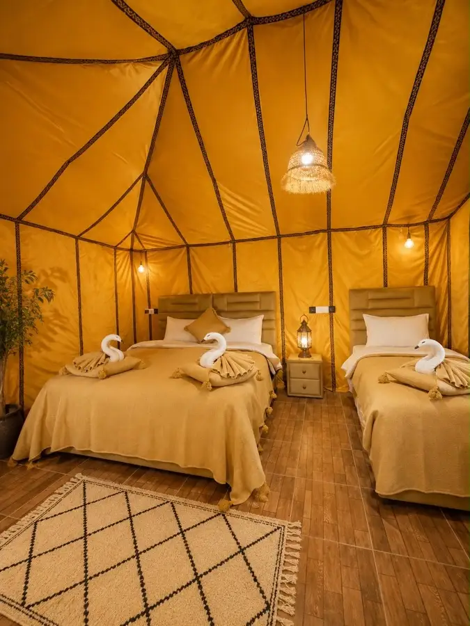 Twin beds in a Berber tent at a Merzouga desert camp