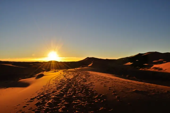 Sun setting over the Erg Chebbi dunes in the Sahara