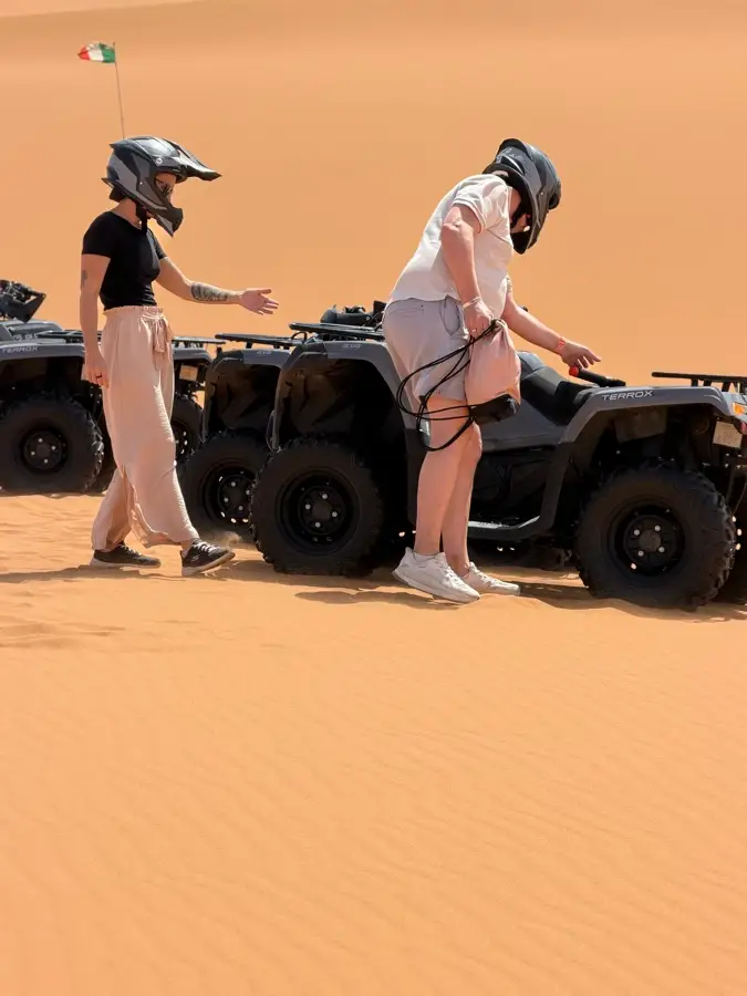 Quad bikes parked on the dunes before sandboarding in Merzouga