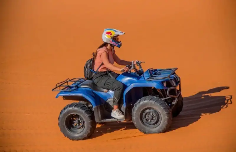 Rider on a blue quad bike in the Merzouga dunes